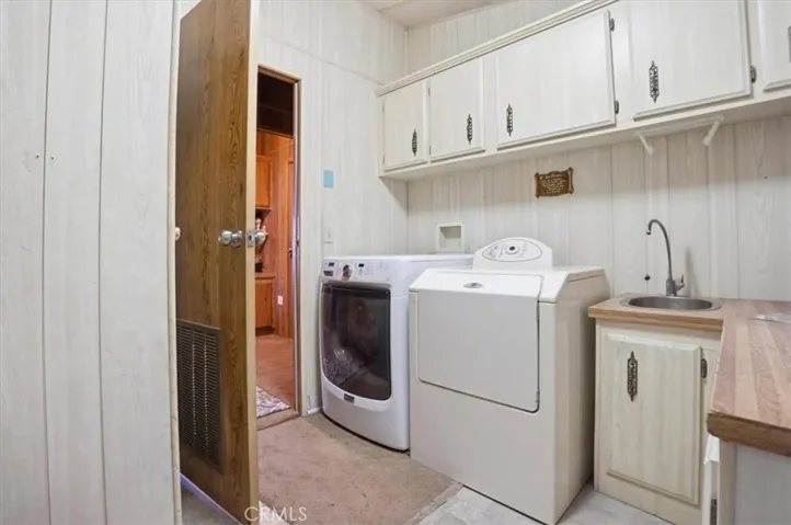 Laundry area with utility sink