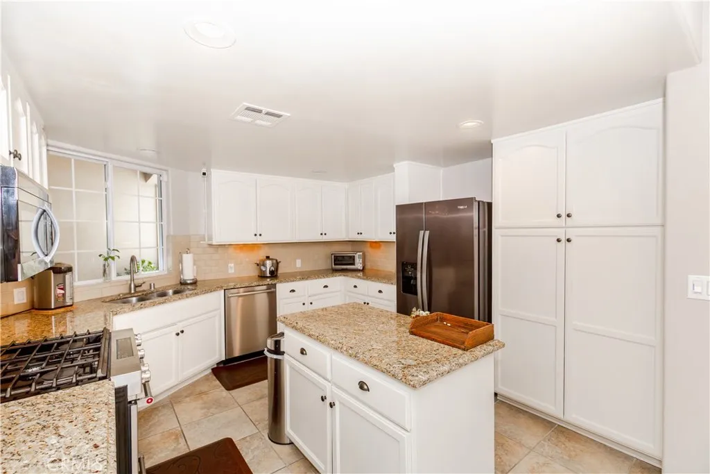 Seamless connection between kitchen, dining and living areas-modern open-concept living at its best.