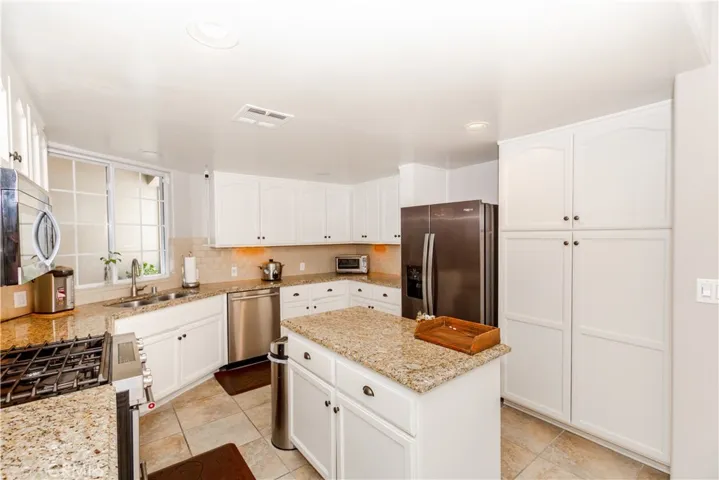 Seamless connection between kitchen, dining and living areas-modern open-concept living at its best.