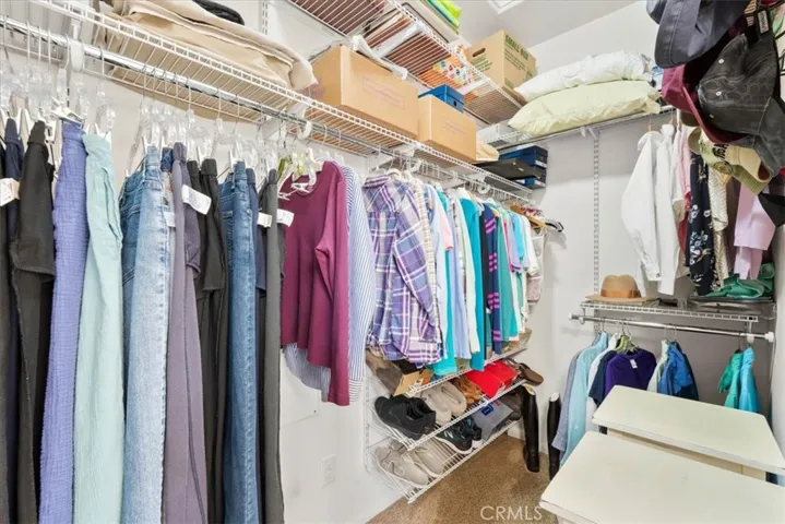 Walk-in closet offering great storage and functionality
