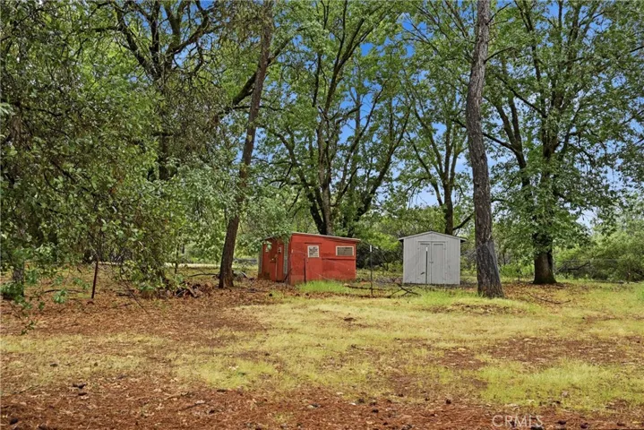 There are a number of storage buildings near close proximity to the the entrance gate and mobile home.