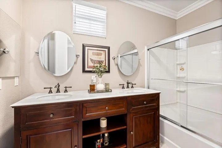 beautifully updated vanity, luxury sized tub with shower