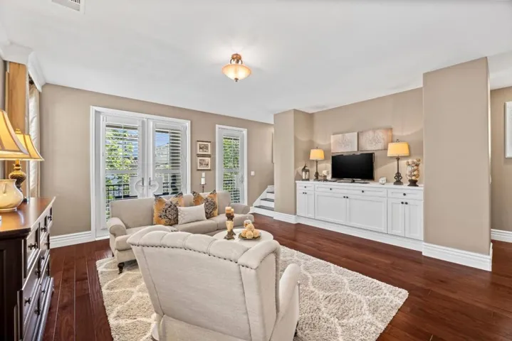 french doors invite pretty views and the balcony extends living outdoors