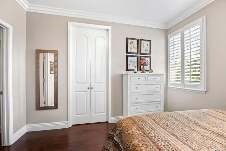 custom doors lead to the ensuite bathroom