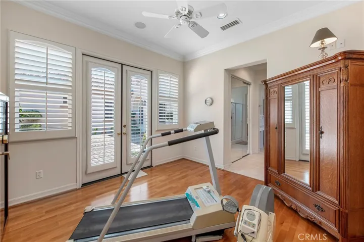 Workout room has double French Doors leading to the Courtyard