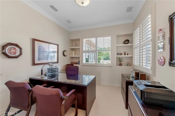 Office with shutters is adjacent the Master Bedroom Wing.