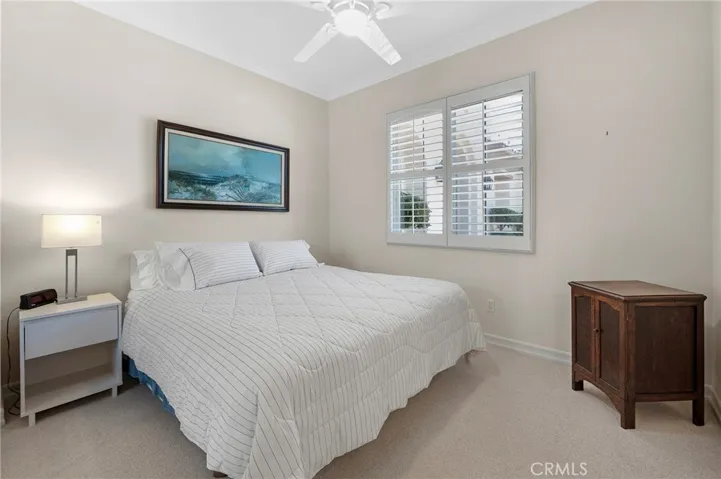 Secondary En Suite Bedroom with Mirrored Closet Doors.