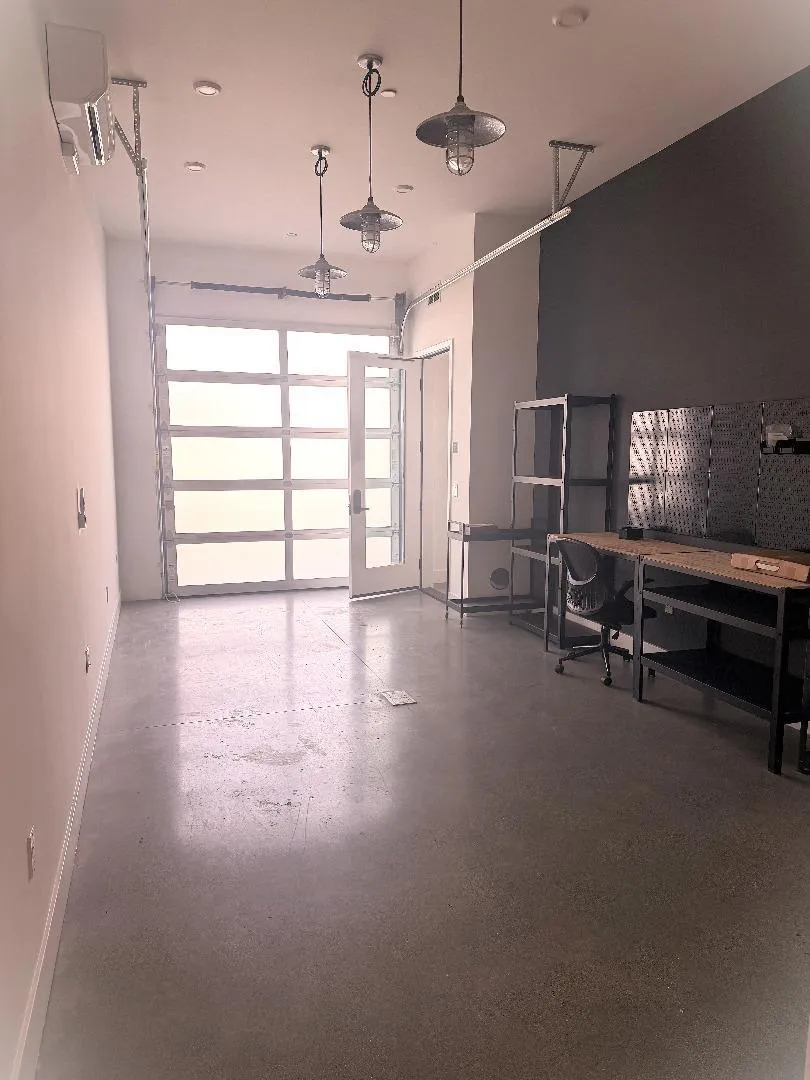 Another shot of the downstairs room with a rolling door for additional natural light and access.