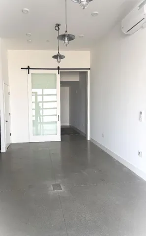Downstairs, an additional room with a private room behind the sliding door and a full bathroom
