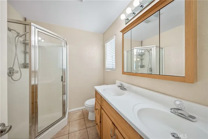 Main Bathroom with Dual Vanities Tile flooring