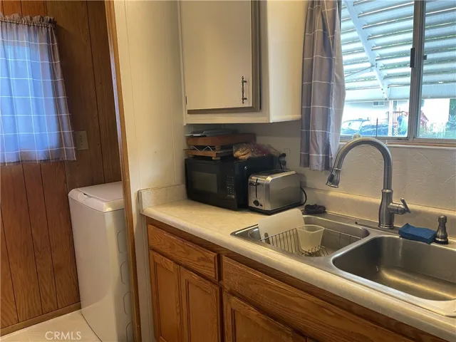 KITCHE N WITH VIEW OF LAUNDRY AREA