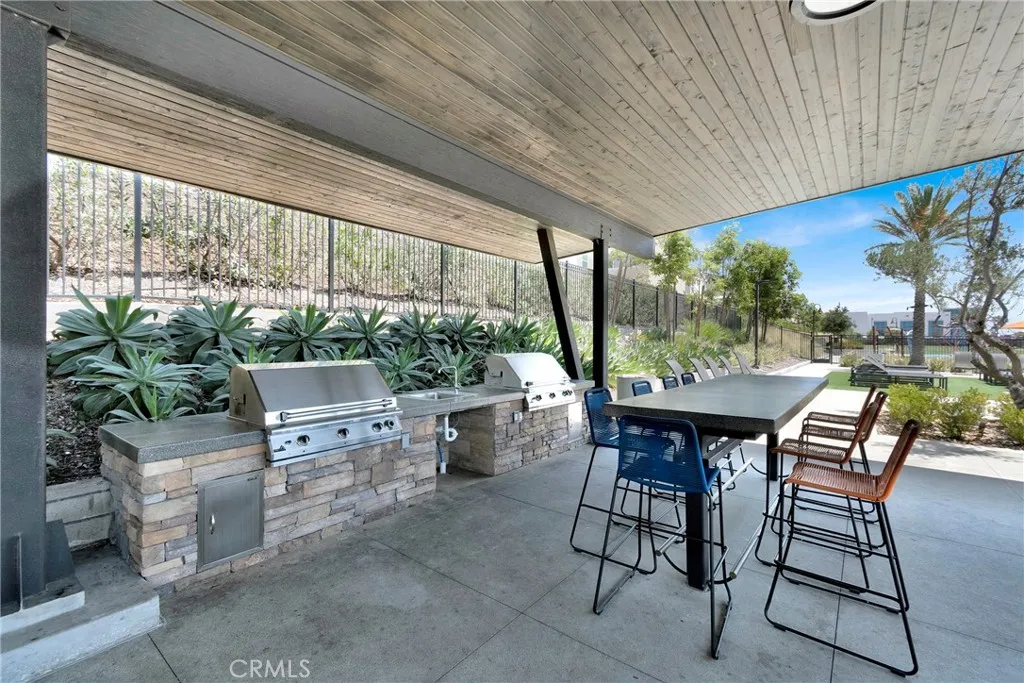 Community amenity patio area with grills and lots of seating area