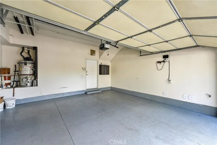Two car attached garage with roll up door