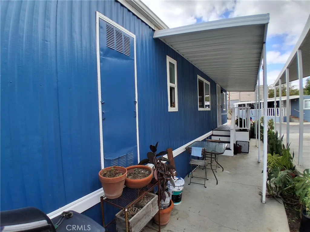 Side Cemented Covered Patio — Perfect for Summer BBQ Days.