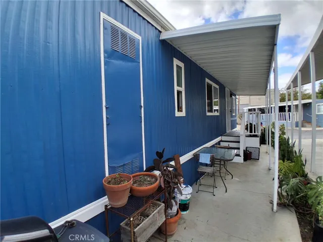 Side Cemented Covered Patio — Perfect for Summer BBQ Days.