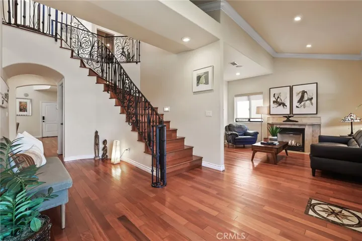 View of staircase and living room.