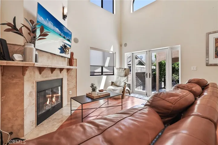 Relaxing family room with access to the lush backyard.