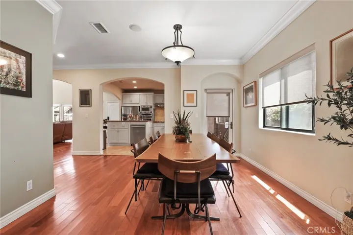 Seemless transition from the living room to the dining room connecting to the gourmet kitchen