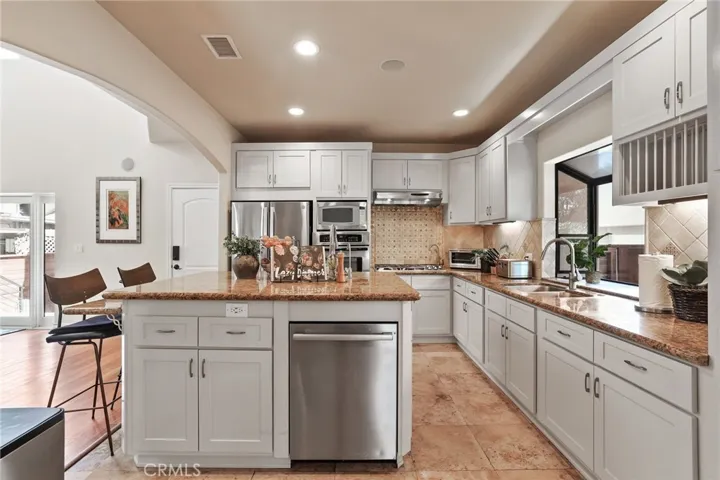 This kitchen has storage galore!  There is even a convenient plate rack for easy access!