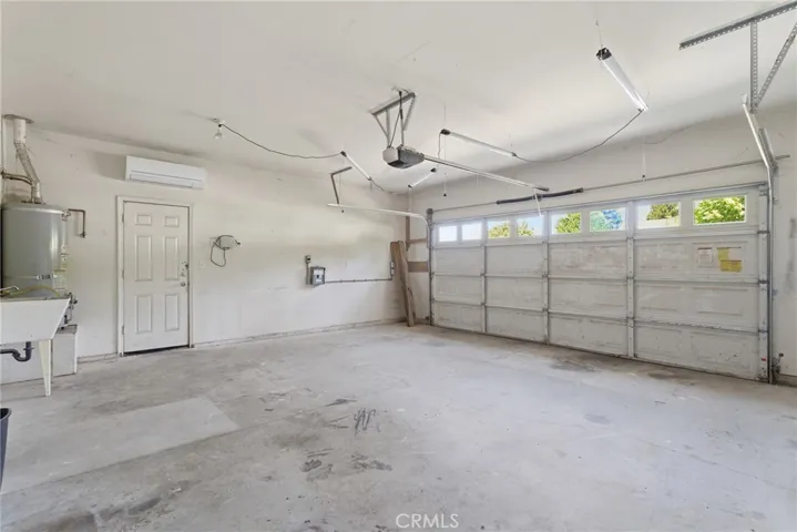 Double car garage with 220v electrical panel and mini split system for maximum comfort while working in the garage!