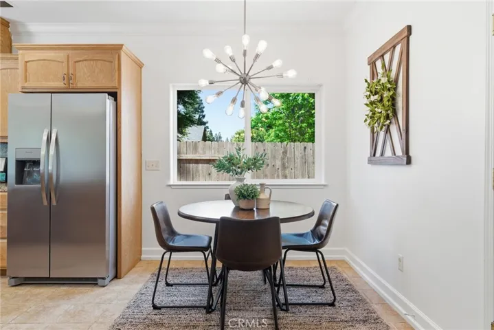 Dining area with a modern light fixture.