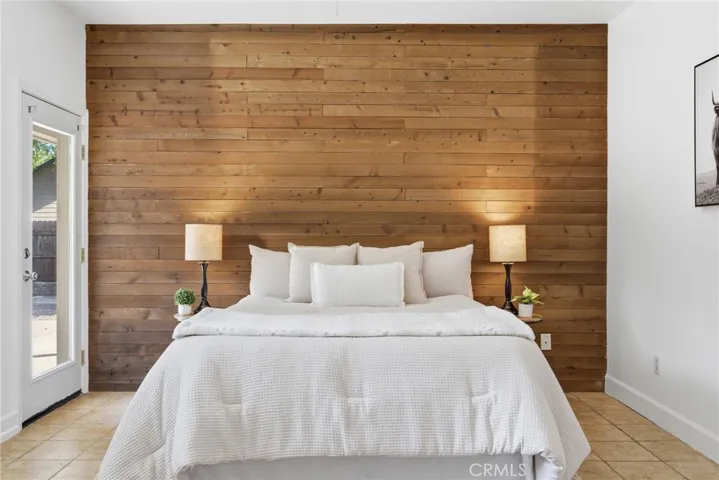 Primary Bedroom with wood slat accent wall