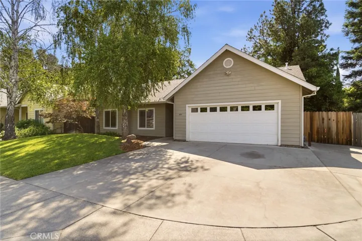 Roomy driveway with gated side yard access