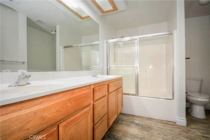 Primary bathroom with dual sinks for her and him