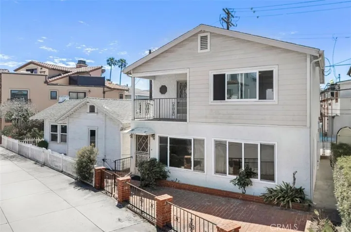 807 W. Bay is the 2 story house, 805 W. Bay is the vintage cottage