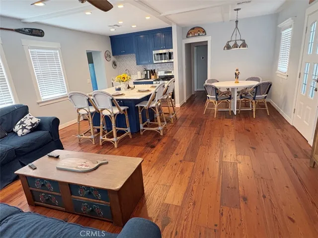 Owner's Unit Living room view towards Dining and Kitchen