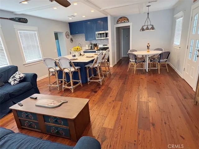 Owner's Unit Living room view towards Dining and Kitchen