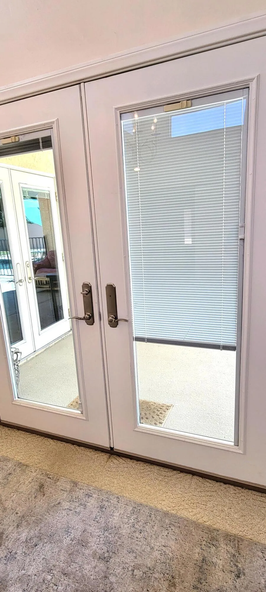 Dual pane french doors with blinds in be