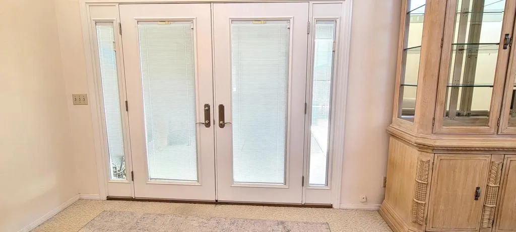 Dual pane french doors with blinds insid