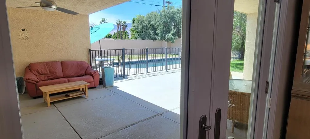 View from Livingroom to backyard and poo