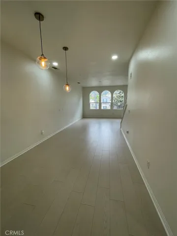 Dining area leading to living room area
