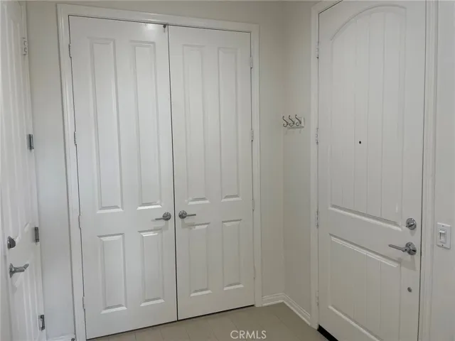 Foyer: coat closet,front door, and garage door.