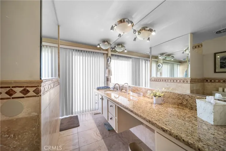 Primary bathroom featuring large vanity