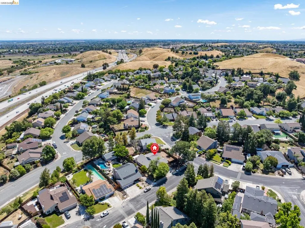 Aerial perspective showcasing a residential neighborhood with varied architectural styles and established landscaping
