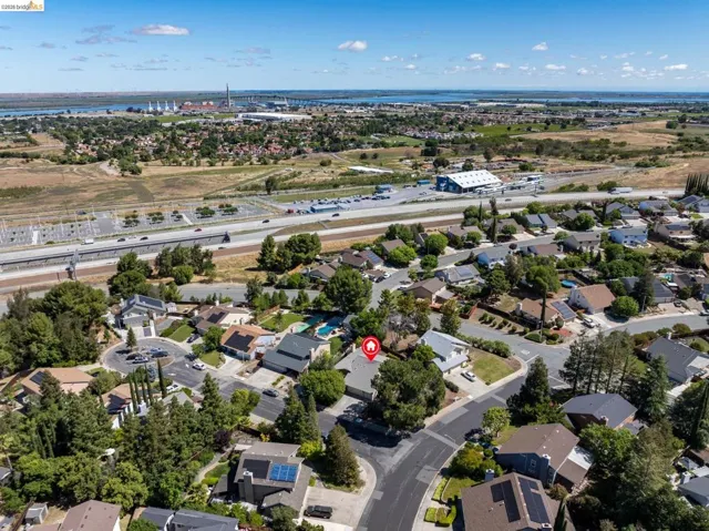 Residential neighborhood with mature trees, established homes, and proximity to highway infrastructure