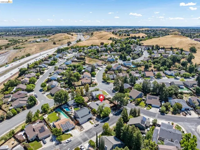 Aerial perspective showcasing a residential neighborhood with varied architectural styles and established landscaping