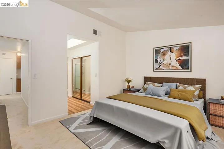 Carpeted flooring in a spacious room featuring a neutral color palette