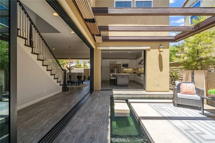 You have to see this to believe this one of a kind island courtyard patio and koi pond area that opens completely to the living room and kitchen with closing ceiling-very high WOW factor!