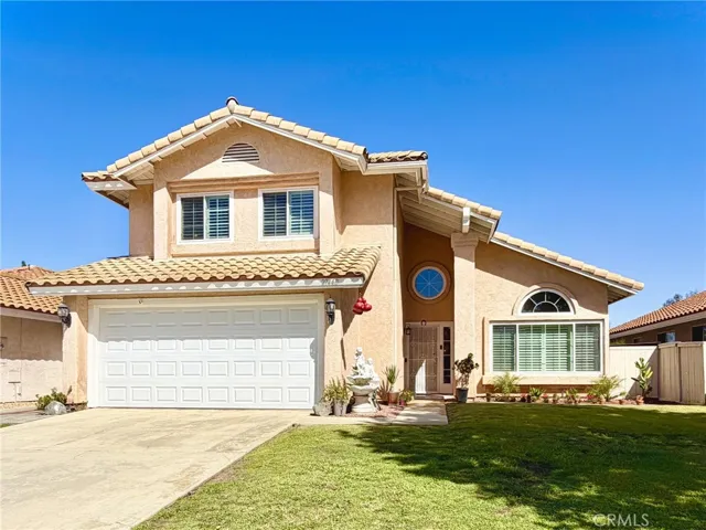 Beautiful 2-story home with great curb appeal, 2-car garage, and inviting front entry.