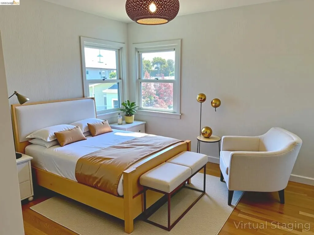 Bedroom featuring wood finished floors and baseboards