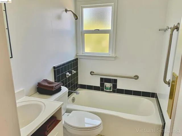 Bathroom featuring vanity and a garden tub