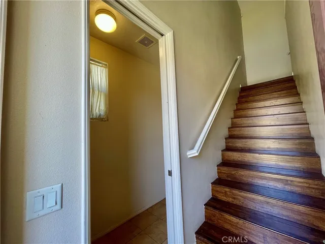 downstairs laundry room next to the stairs