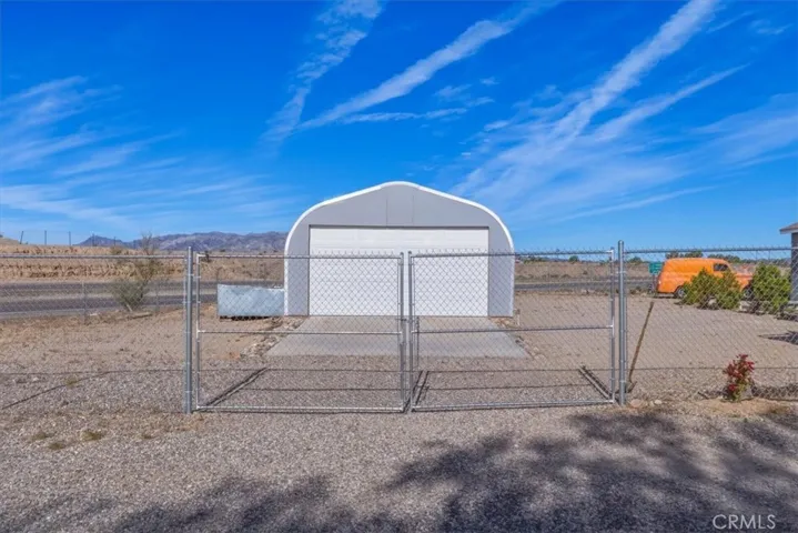 Spacious Garage (quonset hut with roll up door)