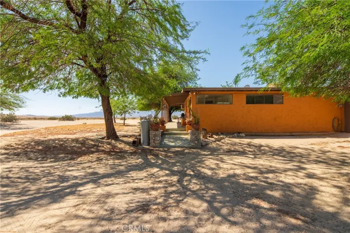 Mature Mesquite trees provide shaded areas around home