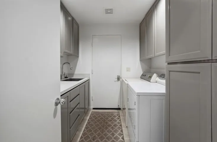 Laundry room with wash basin