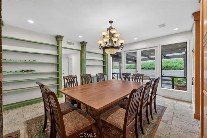 Large Dining Room area with custom built in shelves and cabinets